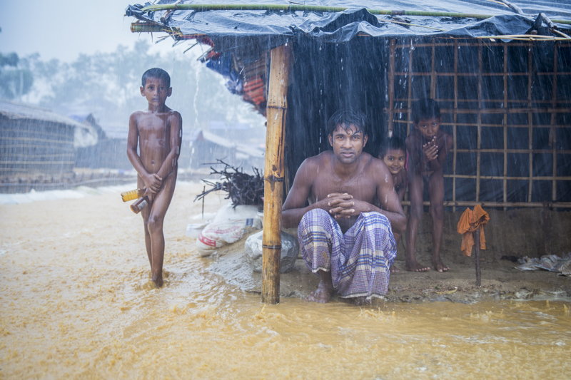 Bangladesh, Myanmar, Family in rain, 2017 © Humberto Tan.